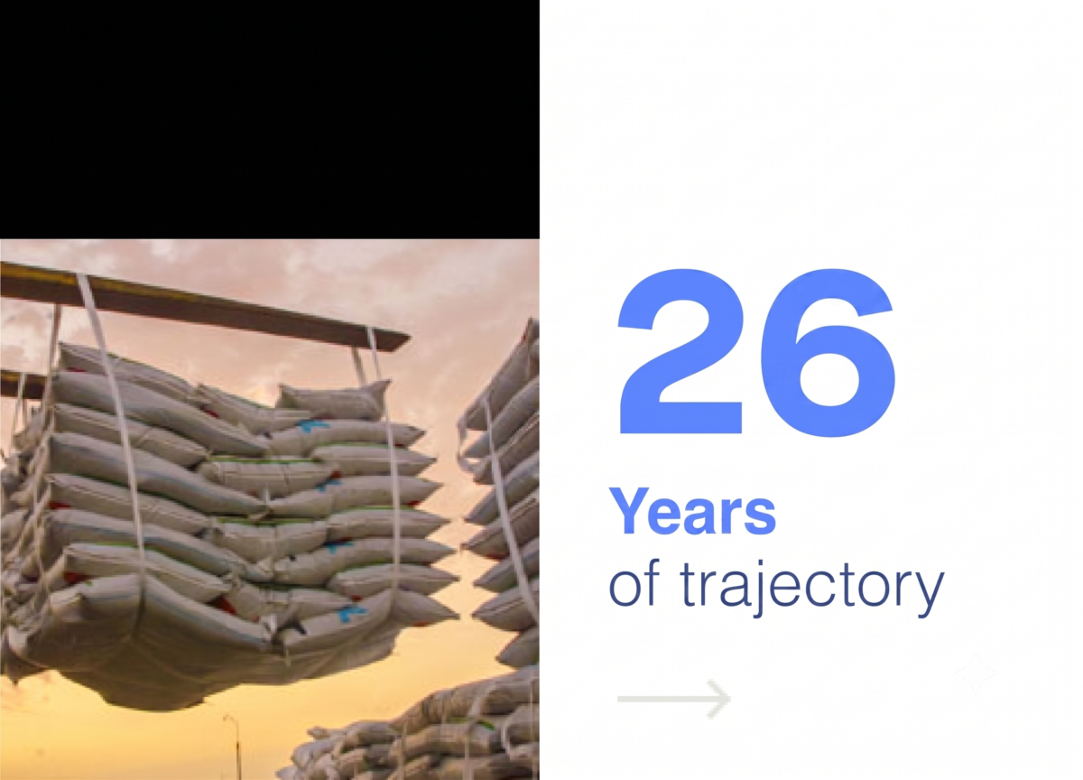 Kristal Group corporate banner celebrating 26 years of trajectory, featuring a photo of bagged products being loaded for export.